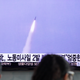 People watch a television broadcast reporting the North Korean missile launch on March 26, 2014 in Seoul, South Korea. Image via Getty.